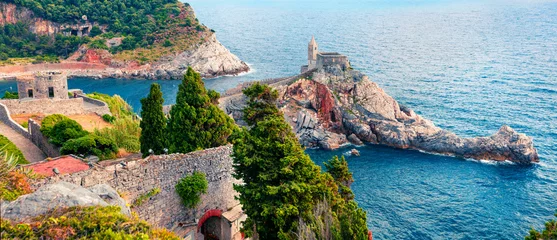 Fototapeten Ligurien Beautiful morning view of Saint Peter Church in Portovenere town. Wonderful spring panorama of Mediterranean sea, Liguria, province of La Spezia, Italy, Europe. Traveling concept background.  © Andrew Mayovskyy
