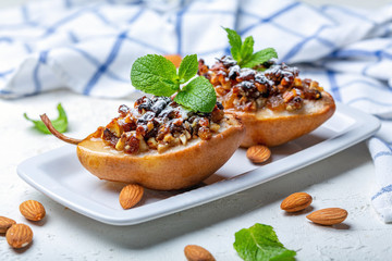 Pears baked with raisins, nuts, honey and mint.