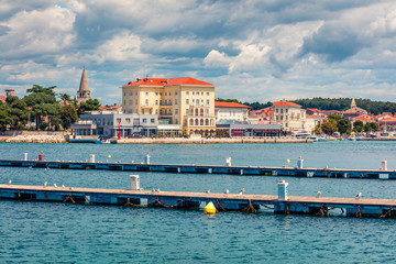 Bright morning cityscape of popular summer resort Porec. Beautiful spring seascape of Adriatic Sea....