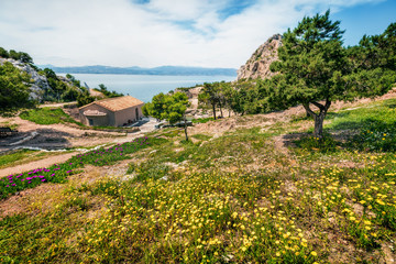 Fototapeta na wymiar Colorful spring view of Agios Ioannis Church. Splendid morning scene of West Court of Heraion of Perachora, Limni Vouliagmenis location, Greece, Europe. Traveling concept background.
