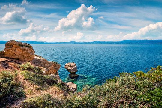 Sunny spring view of West Court of Heraion of Perachora, Limni Vouliagmenis location. Colorful morning seascape of Aegean sea, Greece, Europe. Traveling concept background.