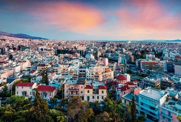Colorful evening view of Athens, capital of Greece, Europe. Fantastic spring sunset in the big sity. Traveling concept background. Artistic style post processed photo.