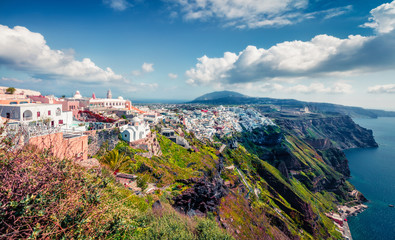 Sunny morning panorama of Santorini island. Great spring view of the famous Greek resort Fira,...