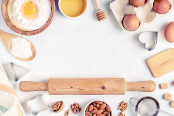 Ingredients for baking  - flour, wooden spoon, eggs.