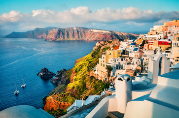 Colorful morning view of Santorini island. Picturesque spring sunrise on the famous Greek resort...