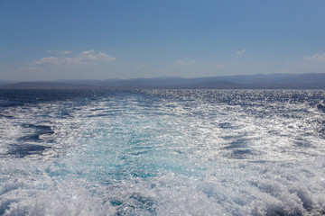 Splashes of clear turquoise sea water on sardinian seashore - 288749557
