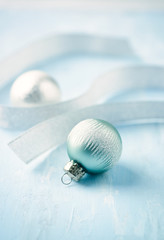 Christmas ornaments on bright wooden background. Close up. Copy sp[ace. 