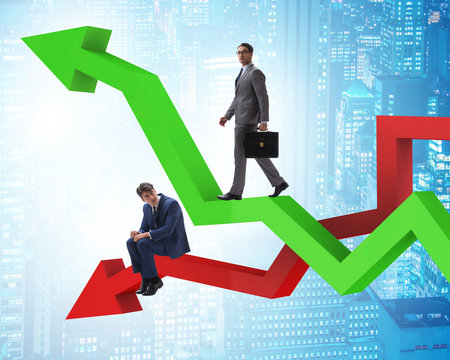 Businessman with charts of growth and decline