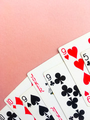 Cards for poker on orange background. Place for text.