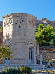 Fototapeta na wymiar Acropolis hill over the winds tower in the Roman forum, Athens Greece