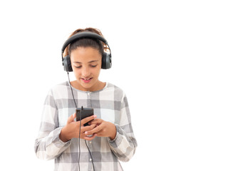 young woman listening to music with headphones and a smartphone isolated on white background