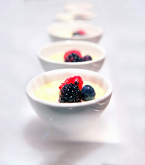 yogurt and mixed berries dessert cups found at restaurant or hotel food buffets