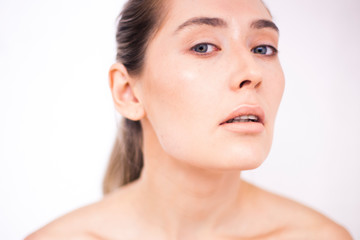 Obraz na płótnie Canvas Closeup young woman portrait with clean healthy face. Woman after beautician procedures.