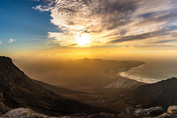 Fototapeta premium Amazing summer sunset over ocean resort beach Famara Lanzarote Canary Islands, Spain