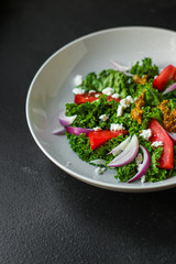 Healthy salad, leaves mix salad (mix micro greens, cucumber, tomato, onion, other ingredients). food background. copy space