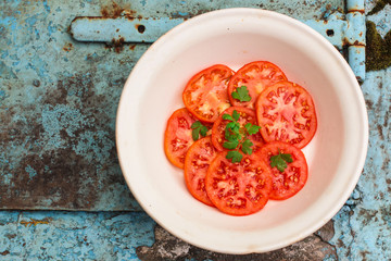 tomatoe salad (carpaccio, sliced ​​raw vegetables). food background. top view. copy space