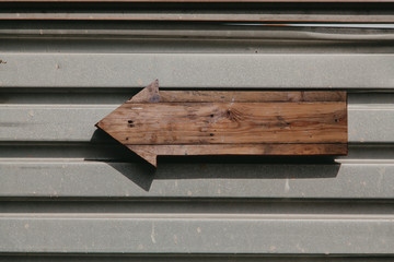 Wooden pointer on  metal surface