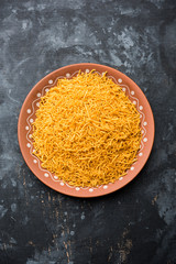 Aloo Bhujiya or Potato Bhujia also known as Namkeen sev. Popular Bikaneri recipe served in a bowl or plate. selective focus