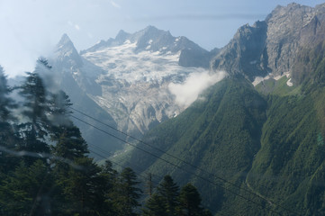 Mountain peak in black, covered with glaciers and snow. Dombay, Russia