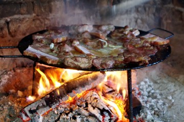 frying meat and bacon on traditional way