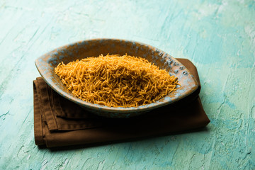 Aloo Bhujiya or Potato Bhujia also known as Namkeen sev. Popular Bikaneri recipe served in a bowl or plate. selective focus