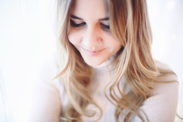 Fototapeta premium young blonde posing at home beautiful long hair
