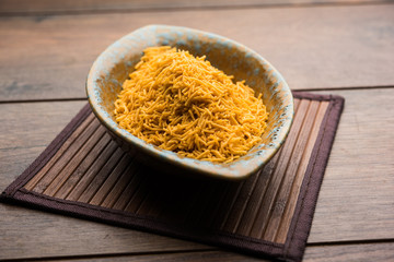 Aloo Bhujiya or Potato Bhujia also known as Namkeen sev. Popular Bikaneri recipe served in a bowl or plate. selective focus