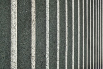 Texture of a gray concrete road sound barrier