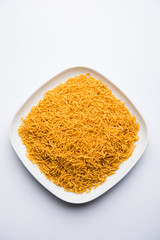 Aloo Bhujiya or Potato Bhujia also known as Namkeen sev. Popular Bikaneri recipe served in a bowl or plate. selective focus