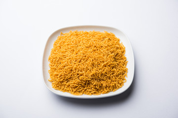 Aloo Bhujiya or Potato Bhujia also known as Namkeen sev. Popular Bikaneri recipe served in a bowl or plate. selective focus