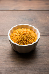 Aloo Bhujiya or Potato Bhujia also known as Namkeen sev. Popular Bikaneri recipe served in a bowl or plate. selective focus