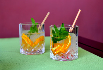 Summer cocktail with orange and mint