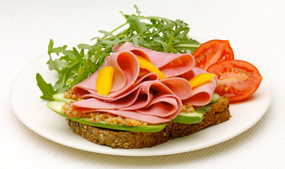 Mango and Ham open Sandwich with  tomato and rocket