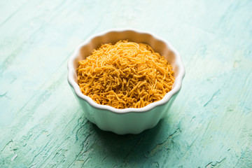 Aloo Bhujiya or Potato Bhujia also known as Namkeen sev. Popular Bikaneri recipe served in a bowl or plate. selective focus