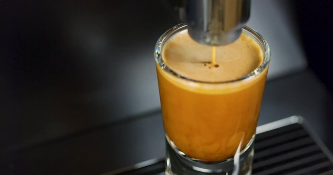 Close-up of strong espresso making at exclusive coffee machine