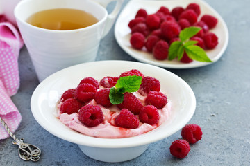 Creamy curd mousse with raspberries. Healthy breakfast.