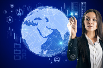 Global trading concept with business woman touching digital searth globe.