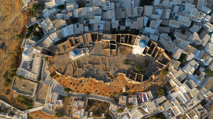 Aerial drone photo of iconic medieval fortified castle overlooking the deep blue Aegean sea in Chora of Astypalaia island, Dodecanese islands, Greece