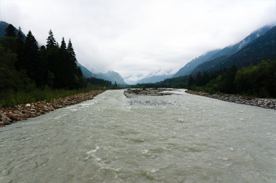 River in the valley between dombay and teberda in the caucasus mountains, russia