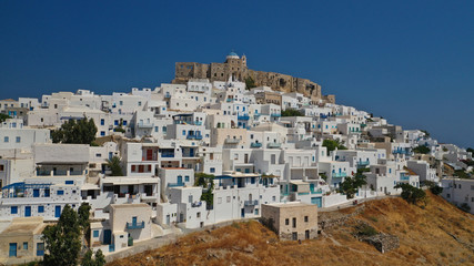 Fototapeta na wymiar Aerial drone photo of iconic medieval fortified castle overlooking the deep blue Aegean sea in Chora of Astypalaia island, Dodecanese islands, Greece