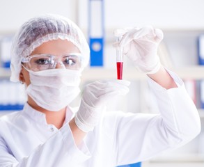 Female scientist researcher conducting an experiment in a labora