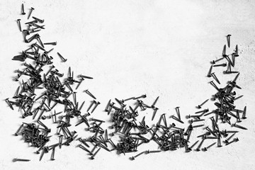 screws on a concrete floor stock photo