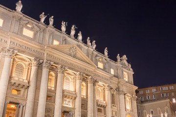 Night shot of St. Peter's Basilica with pope's balcony in Vatican City. 