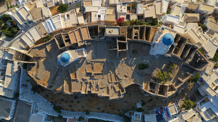 Aerial drone photo of iconic medieval fortified castle overlooking the deep blue Aegean sea in Chora of Astypalaia island, Dodecanese islands, Greece