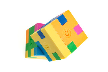 Two cube puzzle of multi-colored rubber shapes. Concept of decision making process, creative, logical thinking. Logical tasks.