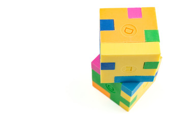 Two cube puzzle of multi-colored rubber shapes. Concept of decision making process, creative, logical thinking. Logical tasks.