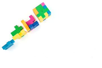 Cube puzzle of multi-colored rubber shapes. Concept of decision making process, creative, logical thinking. Logical tasks.