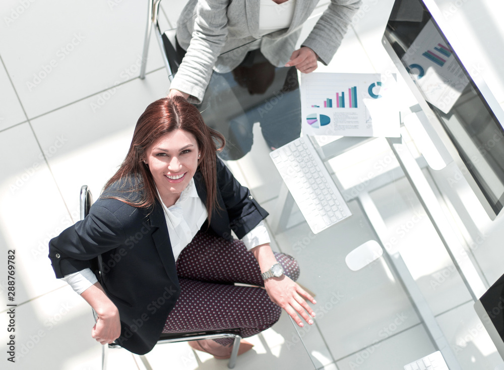 Canvas Prints top view.business team sitting at the Desk and looking at the camera