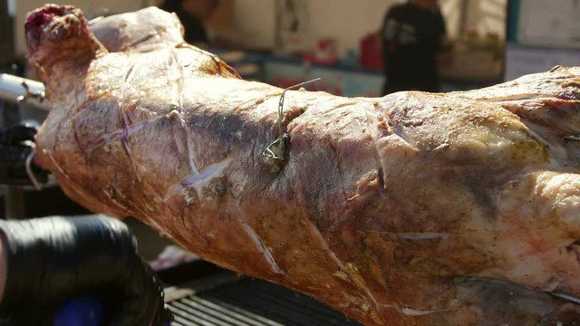 Roasted lamb on the spit. Lamb is basted with a mixture of aromatic spices and wine.