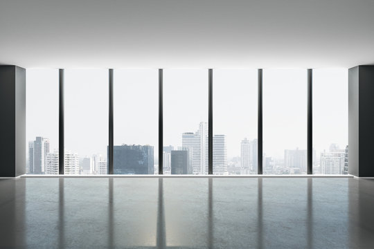Fototapeta City skyscrapers view from glass window from light spacious hall with concrete floor.